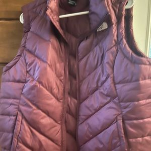 Maroon color women’s The North Face vest size XL in excellent condition.